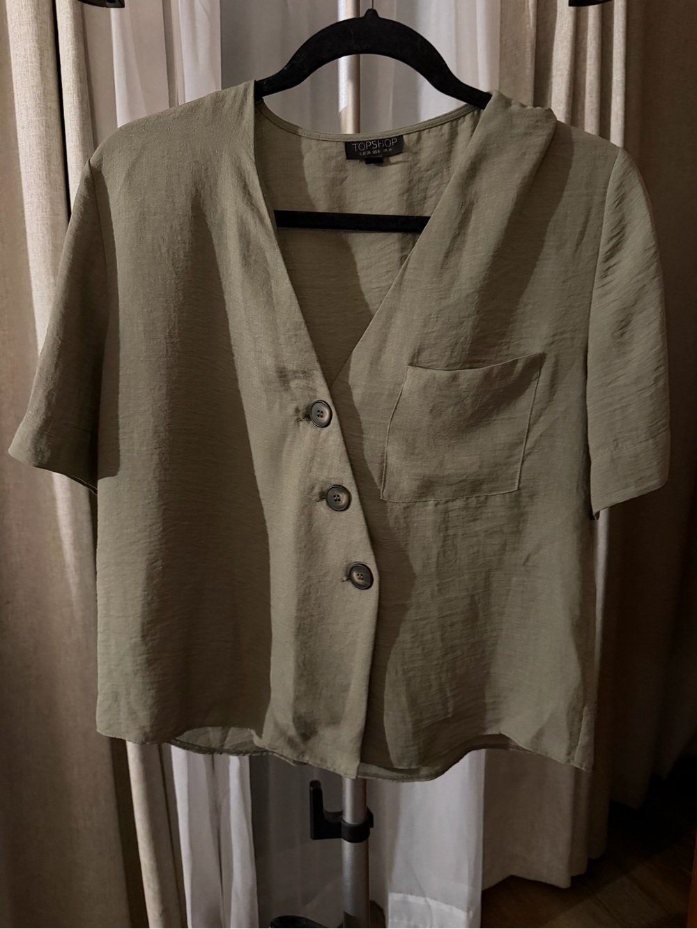 shop women’s short-sleeve blouse, US size 6.